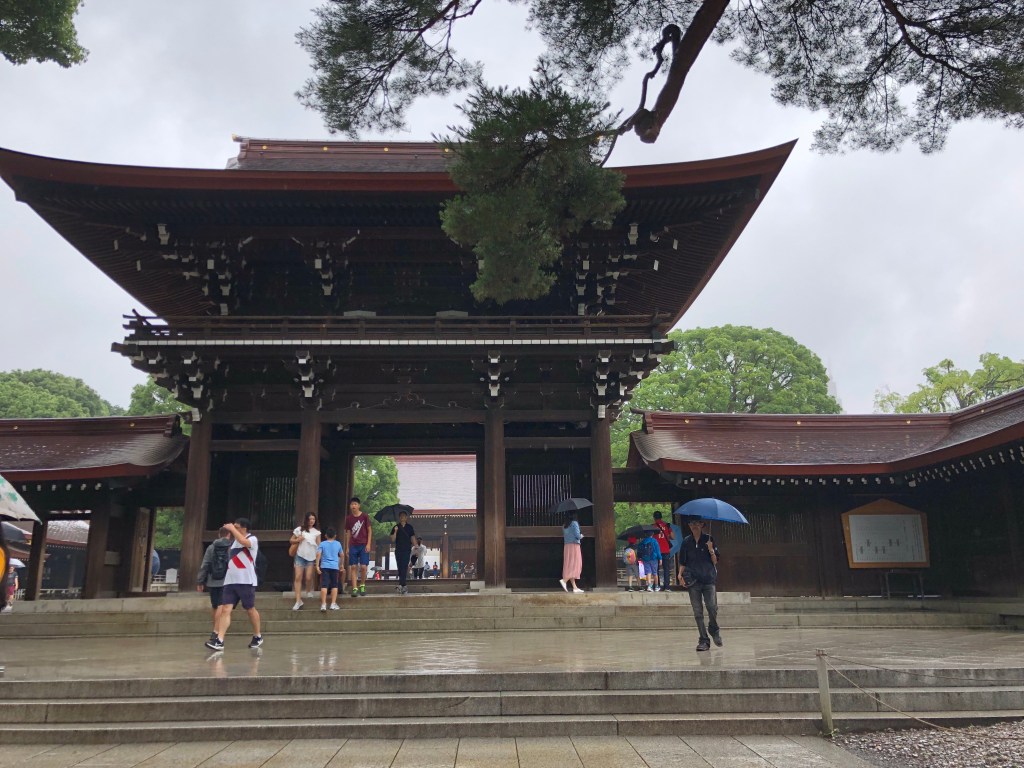 a shrine in the rain with steps leading up
