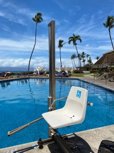 a handicapped chair for lowering people into the pool