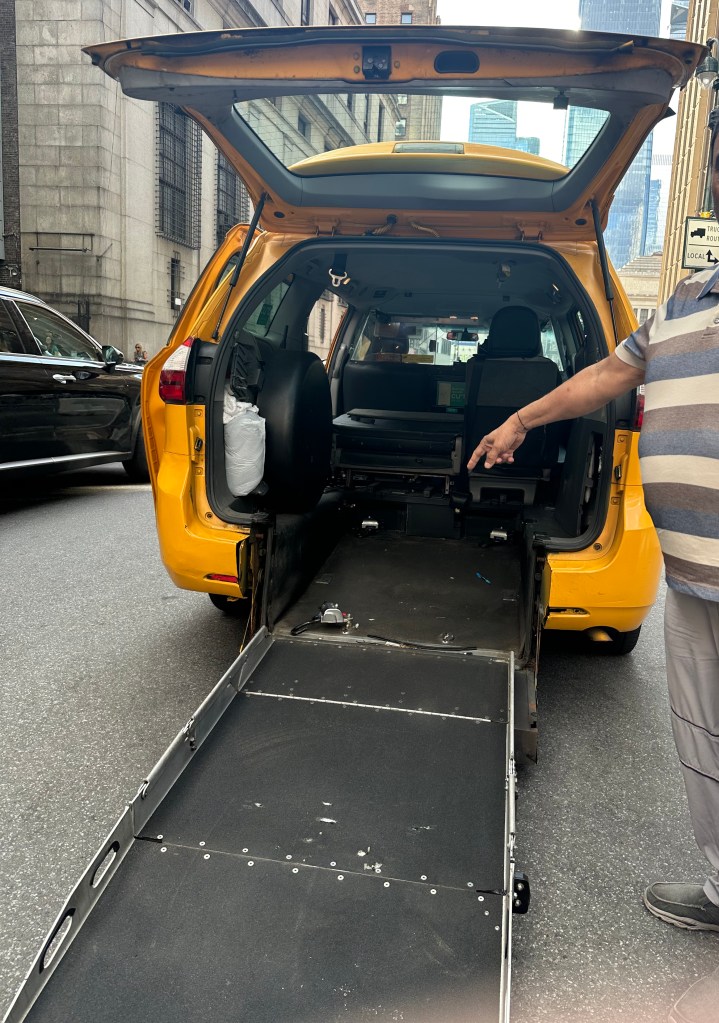 a wheelchair ramp into a taxi